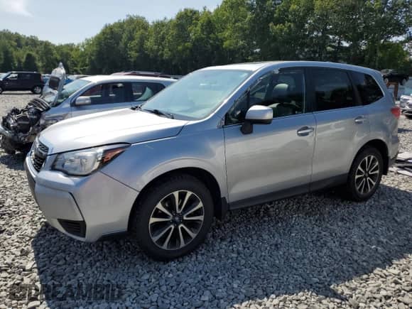 2018 Subaru Forester Premium with VIN JF2SJGECXJH411587, listed as a Copart auction lot 68100385 with 99,274 mi miles and Salvage title. Bid and sale history available at DreamBid. Image 1.