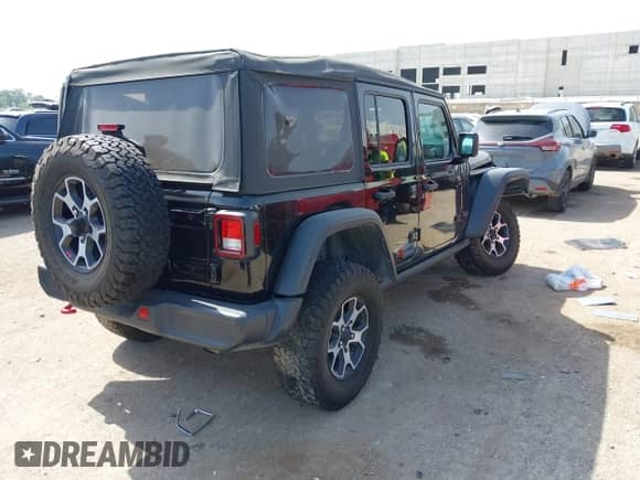 2023 Jeep Wrangler Rubicon with VIN 1C4HJXFN6PW563184, listed as a IAAI auction lot 42766851 with 50,421 mi miles and . Bid and sale history available at DreamBid. Image 4.