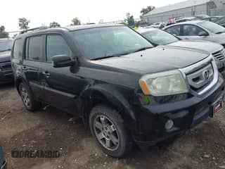 2011 Honda Pilot Touring with VIN 5FNYF4H97BB070823, listed as a IAAI auction lot 43078691 with 217,653 mi miles and . Bid and sale history available at DreamBid. Image 1.