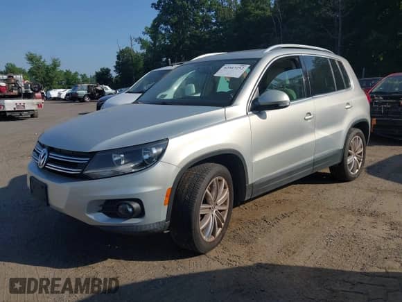 2014 Volkswagen Tiguan SEL with VIN WVGAV3AX2EW554773, listed as a IAAI auction lot 42547252 with 162,573 mi miles and . Bid and sale history available at DreamBid. Image 2.