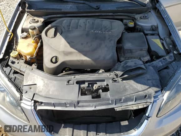 2013 Chrysler 200 Touring z VIN 1C3CCBBG7DN717051, wystawiony jako Copart lot #81341715 z przebiegiem 163 555 mil mil oraz Szkoda całkowita • Salvage title. Historia ofert i sprzedaży dostępna na DreamBid. Obrazek 11.