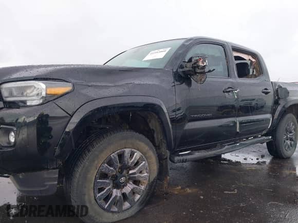2022 Toyota Tacoma Limited with VIN 3TMGZ5AN4NM463887, listed as a IAAI auction lot 41592060 with 61,026 mi miles and . Bid and sale history available at DreamBid. Image 6.