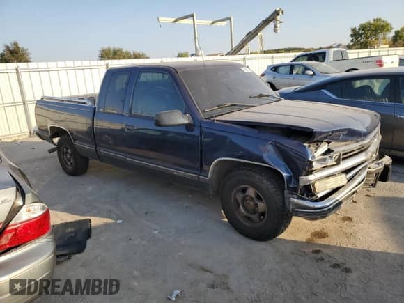1999 Chevrolet Silverado 1500 with VIN 1GCEC19R7XR140542, listed as a Copart auction lot 74936724 with 348,313 mi miles and Salvage title. Bid and sale history available at DreamBid. Image 4.