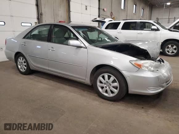 2002 Toyota Camry LE с VIN 4T1BE32K62U581375, выставлен на аукционе Copart как лот 82677185 с пробегом 163 800 миль миль и Списание • Salvage title. История ставок и продаж доступна на DreamBid. Изображение 4.