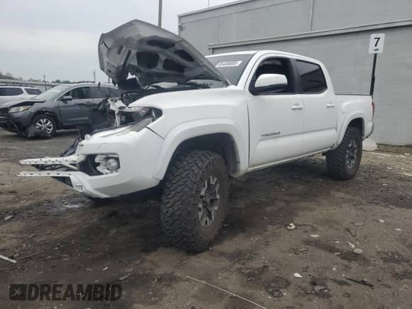 2018 Toyota Tacoma TRD Off Road with VIN 3TMCZ5ANXJM138363, listed as a Copart auction lot 84400805 with 95,418 mi miles and Salvage title. Bid and sale history available at DreamBid. Image 1.