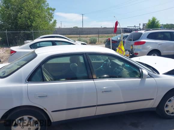 2000 Honda Accord LX z VIN JHMCG564XYC002539, wystawiony jako IAAI lot #42397734 z przebiegiem 186 918 mil mil oraz . Historia ofert i sprzedaży dostępna na DreamBid. Obrazek 13.