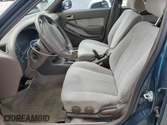 1996 Toyota Camry DX z VIN 4T1BG12K0TU771270, wystawiony jako Copart lot #64760345 z przebiegiem 198 961 mil mil oraz Nie do naprawy • Non repairable. Historia ofert i sprzedaży dostępna na DreamBid. Obrazek 7.