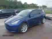 2022 Tesla Model Y Long Range z VIN 7SAYGAEE1NF399523, wystawiony jako IAAI lot #43175077 z przebiegiem 115 467 mil mil oraz . Historia ofert i sprzedaży dostępna na DreamBid. Obrazek 2.