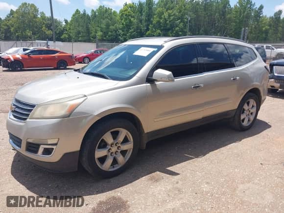 2013 Chevrolet Traverse LT z VIN 1GNKRGKD7DJ135457, wystawiony jako IAAI lot #42769880 z przebiegiem 230 790 mil mil oraz . Historia ofert i sprzedaży dostępna na DreamBid. Obrazek 2.