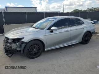 2022 Toyota Camry XSE with VIN 4T1K61AK8NU032641, listed as a Copart auction lot 83762315 with 99,779 mi miles and Salvage title. Bid and sale history available at DreamBid. Image 1.