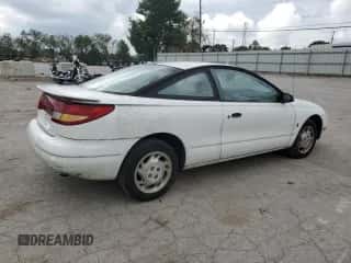 1997 Saturn SC с VIN 1G8ZF1282VZ133256, выставлен на аукционе Copart как лот 74026354 с пробегом 84 564 миль миль и Списание • Salvage title. История ставок и продаж доступна на DreamBid. Изображение 3.