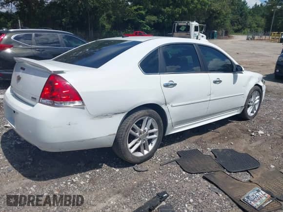 2014 Chevrolet Impala LTZ with VIN 2G1WC5E30E1181722, listed as a IAAI auction lot 42972885 with 122,847 mi miles and . Bid and sale history available at DreamBid. Image 4.
