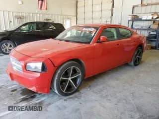 2010 Dodge Charger with VIN 2B3CA4CD4AH300056, listed as a Copart auction lot 69048715 with 128,132 mi miles and Salvage title. Bid and sale history available at DreamBid. Image 1.