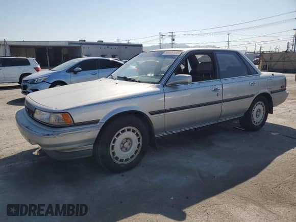 1990 Toyota Camry with VIN JT2VV22E3L3003353, listed as a Copart auction lot 68489125 with 131,662 mi miles and Clean title. Bid and sale history available at DreamBid. Image 1.