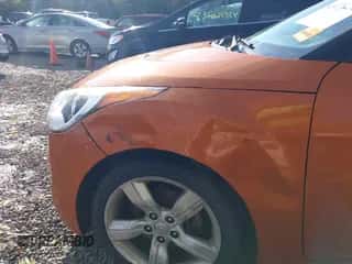 2012 Hyundai Veloster w/Red Int z VIN KMHTC6AD8CU065650, wystawiony jako IAAI lot #43576272 z przebiegiem 147 621 mil mil oraz . Historia ofert i sprzedaży dostępna na DreamBid. Obrazek 6.