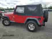 1998 Jeep Wrangler SE with VIN 1J4FY29P8WP767006, listed as a Copart auction lot 55603315 with 146,169 mi miles and Salvage title. Bid and sale history available at DreamBid. Image 2.