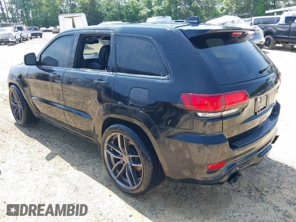 2014 Jeep Grand Cherokee SRT-8 z VIN 1C4RJFDJ7EC527372, wystawiony jako IAAI lot #41889040 z przebiegiem 120 015 mil mil oraz . Historia ofert i sprzedaży dostępna na DreamBid. Obrazek 3.