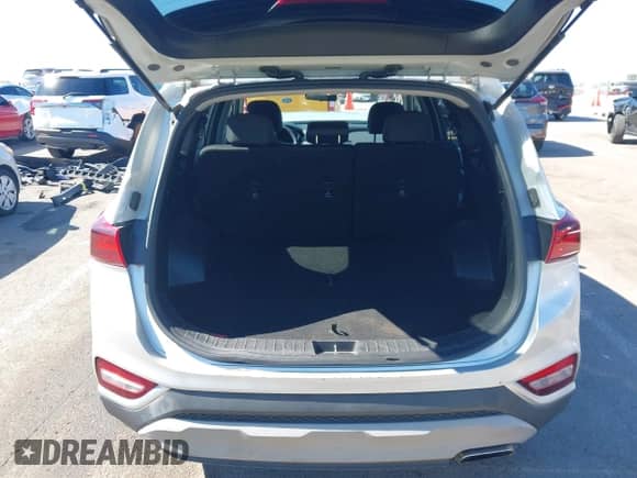 2019 Hyundai Santa Fe SE with VIN 5NMS23AD4KH100188, listed as a IAAI auction lot 43374582 with 88,759 mi miles and . Bid and sale history available at DreamBid. Image 17.