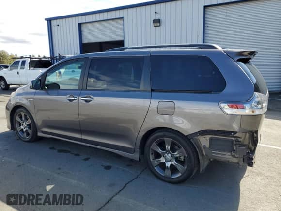 2015 Toyota Sienna SE with VIN 5TDXK3DC6FS622851, listed as a Copart auction lot 82207425 with 112,162 mi miles and Salvage title. Bid and sale history available at DreamBid. Image 2.
