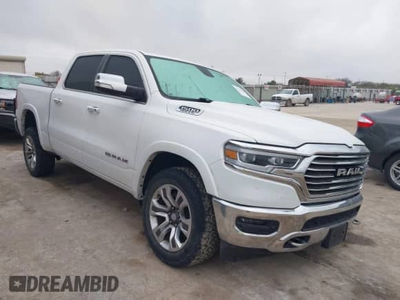 2020 Ram 1500 Longhorn with VIN 1C6SRFKT5LN304433, listed as a IAAI auction lot 41172491 with 121,344 mi miles and . Bid and sale history available at DreamBid. Image 1.