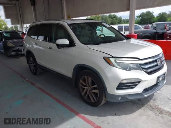 2017 Honda Pilot Touring with VIN 5FNYF5H91HB015492, listed as a IAAI auction lot 43251136 with 131,082 mi miles and . Bid and sale history available at DreamBid. Image 1.