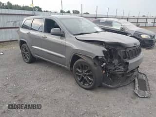 2022 Jeep Grand Cherokee Laredo E with VIN 1C4RJEAG9NC128305, listed as a IAAI auction lot 43037060 with 80,434 mi miles and . Bid and sale history available at DreamBid. Image 1.