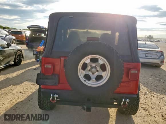 2000 Jeep Wrangler SE with VIN 1J4FA29P4YP798115, listed as a Copart auction lot 80751605 with 119,345 mi miles and Salvage title. Bid and sale history available at DreamBid. Image 6.