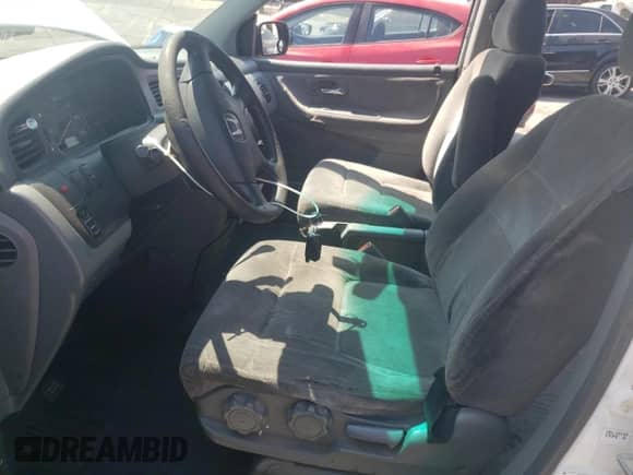 2002 Honda Odyssey LX с VIN 2HKRL18542H527520, выставлен на аукционе Copart как лот 80103335 с пробегом Не указан миль и Списание • Salvage title. История ставок и продаж доступна на DreamBid. Изображение 7.