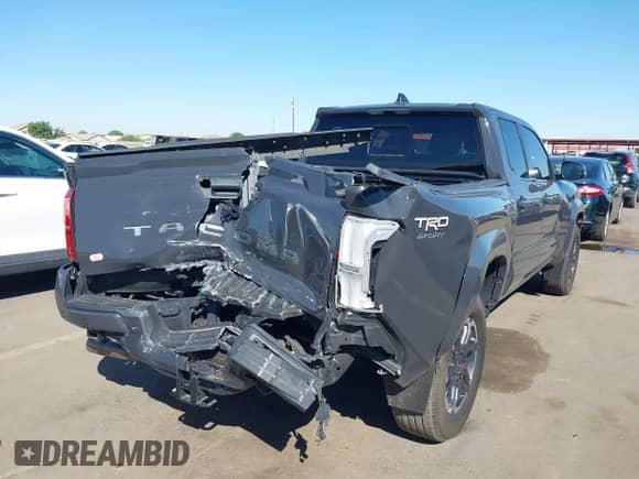 2024 Toyota Tacoma SR5 with VIN 3TMLB5FN8RM005075, listed as a IAAI auction lot 43290415 with 20,318 mi miles and . Bid and sale history available at DreamBid. Image 6.