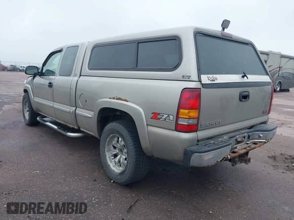 2002 GMC Sierra 1500 SLE z VIN 2GTEK19TX21147176, wystawiony jako IAAI lot #42548008 z przebiegiem 308 911 mil mil oraz . Historia ofert i sprzedaży dostępna na DreamBid. Obrazek 3.