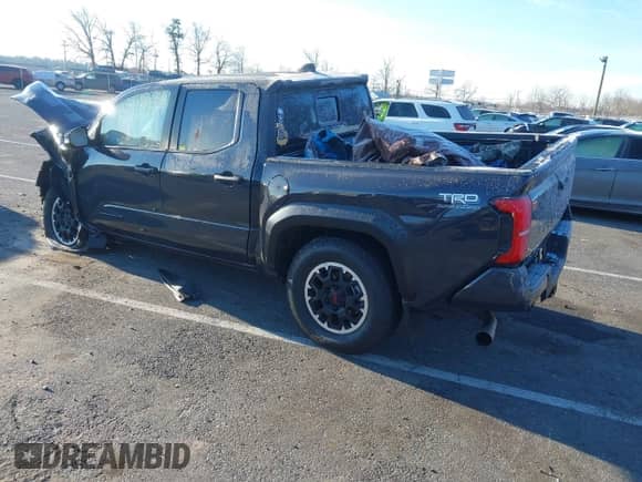 2024 Toyota Tacoma SR5 with VIN 3TMLB5JN3RM028853, listed as a IAAI auction lot 40990601 with 10,095 mi miles and . Bid and sale history available at DreamBid. Image 3.