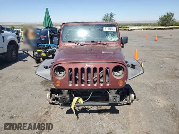 2007 Jeep Wrangler Unlimited Sahara z VIN 1J4GA59157L122909, wystawiony jako Copart lot #67484885 z przebiegiem Nie podano mil oraz Szkoda całkowita • Salvage title. Historia ofert i sprzedaży dostępna na DreamBid. Obrazek 5.