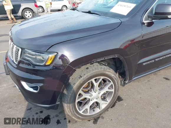 2018 Jeep Grand Cherokee Sterling with VIN 1C4RJFBT8JC326885, listed as a IAAI auction lot 43028769 with 124,755 mi miles and . Bid and sale history available at DreamBid. Image 20.