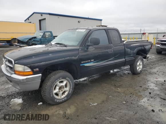 1997 Dodge Dakota with VIN 1B7GG23Y2VS152221, listed as a Copart auction lot 86370114 with 176,812 mi miles and Salvage title. Bid and sale history available at DreamBid. Image 1.