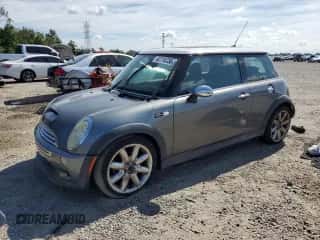 2006 MINI Hardtop S with VIN WMWRE335X6TJ40269, listed as a Copart auction lot 62719735 with 96,215 mi miles and Salvage title. Bid and sale history available at DreamBid. Image 1.