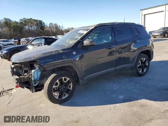 2017 Jeep Compass Trailhawk with VIN 3C4NJDDB3HT656830, listed as a Copart auction lot 86705404 with 50,753 mi miles and Salvage title. Bid and sale history available at DreamBid. Image 1.