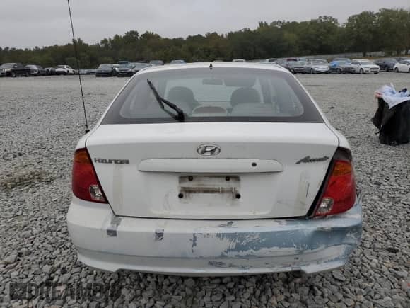 2004 Hyundai Accent GL z VIN KMHCG35C14U311640, wystawiony jako Copart lot #78511284 z przebiegiem 175 004 mil mil oraz Szkoda całkowita • Salvage title. Historia ofert i sprzedaży dostępna na DreamBid. Obrazek 6.