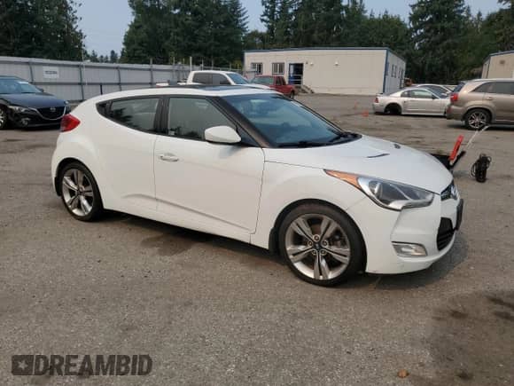 2014 Hyundai Veloster z VIN KMHTC6ADXEU187204, wystawiony jako Copart lot #71670725 z przebiegiem 94 917 mil mil oraz Czysty tytuł • Clean title. Historia ofert i sprzedaży dostępna na DreamBid. Obrazek 4.