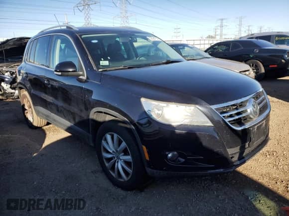 2011 Volkswagen Tiguan SE with VIN WVGAV7AX8BW503216, listed as a Copart auction lot 82094744 with 153,350 mi miles and Clean title. Bid and sale history available at DreamBid. Image 4.