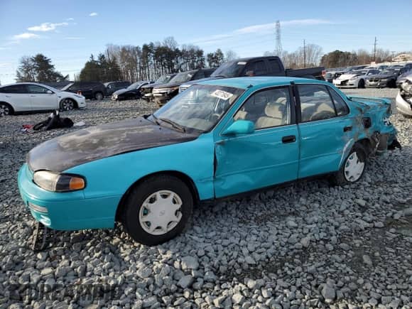 1995 Toyota Camry DX z VIN 4T1SK11E7SU597237, wystawiony jako Copart lot #43271845 z przebiegiem 237 581 mil mil oraz Szkoda całkowita • Salvage title. Historia ofert i sprzedaży dostępna na DreamBid. Obrazek 1.