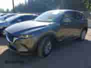 2023 Mazda CX-5 S Carbon Edition z VIN JM3KFBCM6P0143148, wystawiony jako IAAI lot #43382486 z przebiegiem 22 099 mil mil oraz . Historia ofert i sprzedaży dostępna na DreamBid. Obrazek 2.