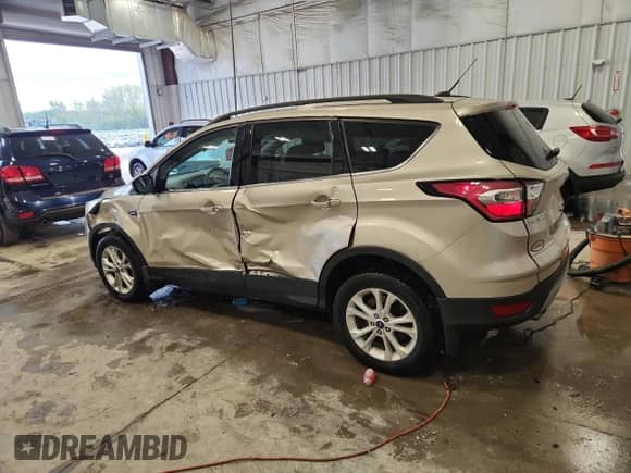 2017 Ford Escape SE с VIN 1FMCU9GD7HUC21075, выставлен на аукционе Copart как лот 82115645 с пробегом 91 949 миль миль и На запчасти • Non repairable. История ставок и продаж доступна на DreamBid. Изображение 2.