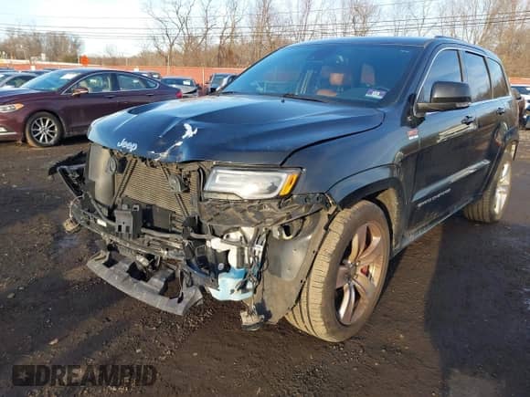 2015 Jeep Grand Cherokee SRT with VIN 1C4RJFDJ6FC744087, listed as a IAAI auction lot 41500653 with 130,530 mi miles and . Bid and sale history available at DreamBid. Image 2.