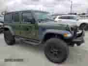 2023 Jeep Wrangler with VIN 1C4JJXN6XPW592022, listed as a Copart auction lot 84292005 with 33,727 mi miles and Salvage title. Bid and sale history available at DreamBid. Image 4.