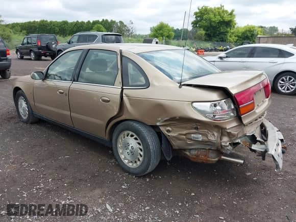 2001 Saturn LS with VIN 1G8JU52F31Y574466, listed as a IAAI auction lot 42539936 with 133,551 mi miles and . Bid and sale history available at DreamBid. Image 3.