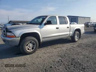 2003 Dodge Dakota SLT z VIN 1D7HG48N83S124490, wystawiony jako Copart lot #80144835 z przebiegiem 197 762 mil mil oraz Czysty tytuł • Clean title. Historia ofert i sprzedaży dostępna na DreamBid. Obrazek 1.