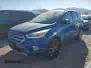 2017 Ford Escape Titanium with VIN 1FMCU9J97HUC07973, listed as a Copart auction lot 80717215 with 129,024 mi miles and Salvage title. Bid and sale history available at DreamBid. Image 1.