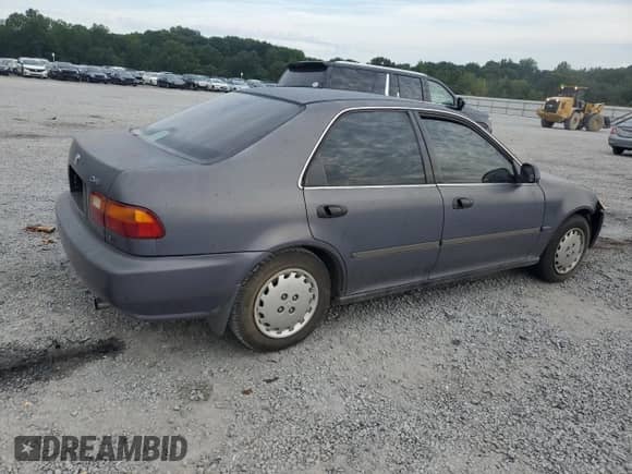 1994 Honda Civic with VIN 1HGEG8658RL009528, listed as a Copart auction lot 70803805 with 195,525 mi miles and Salvage title. Bid and sale history available at DreamBid. Image 3.