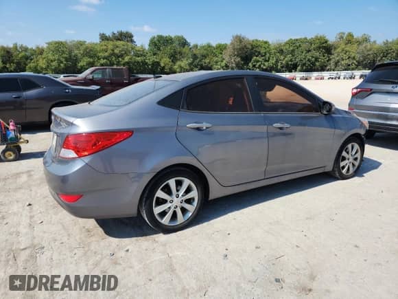 2014 Hyundai Accent GLS z VIN KMHCU4AE8EU624837, wystawiony jako Copart lot #85711535 z przebiegiem 127 432 mil mil oraz Szkoda całkowita • Salvage title. Historia ofert i sprzedaży dostępna na DreamBid. Obrazek 3.