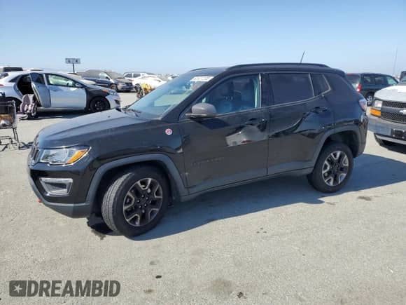 2017 Jeep Compass Trailhawk with VIN 3C4NJDDB1HT689762, listed as a Copart auction lot 60937205 with 99,282 mi miles and Salvage title. Bid and sale history available at DreamBid. Image 1.